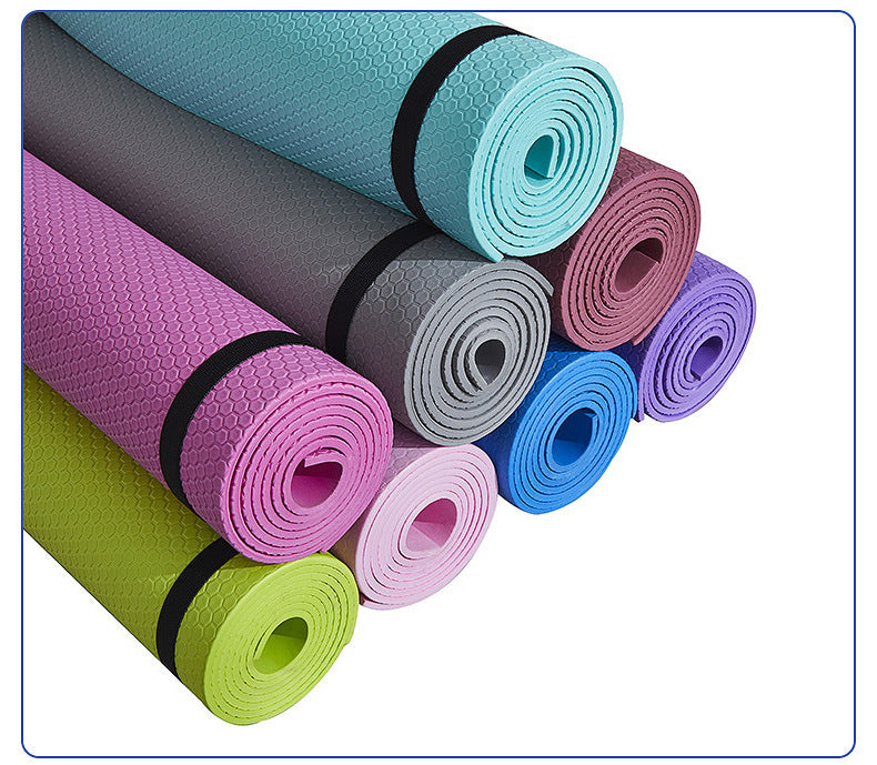Colorful Yoga Mat Fitness Moisture-proof Thickened EVA rolled up in various shades for exercise and yoga.